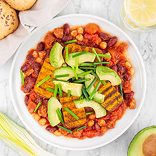 breakfast in a no-fish box diet - shakshuka with tofu, chorizo, chickpeas and beans, avocado slices, wholemeal bread