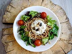 Diet food delivered to your door, whole-grain spaghetti a'la carbonara served with mixed salad